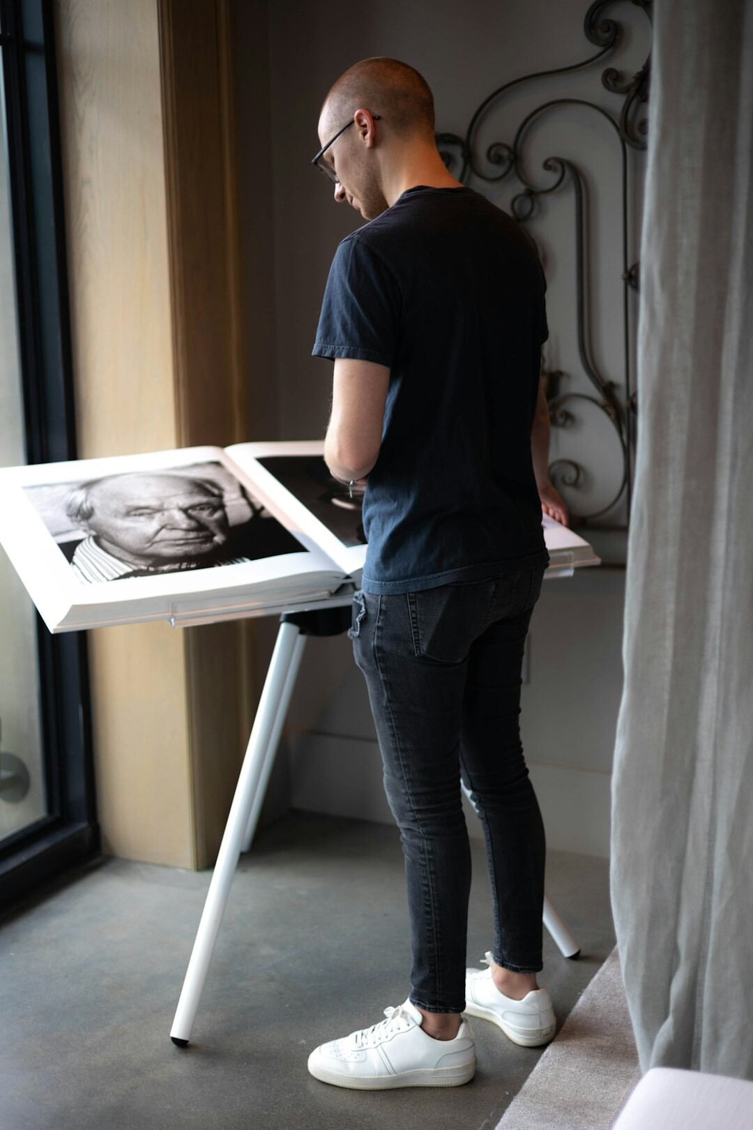 Portrait of a Danish photo editor reviewing prints
