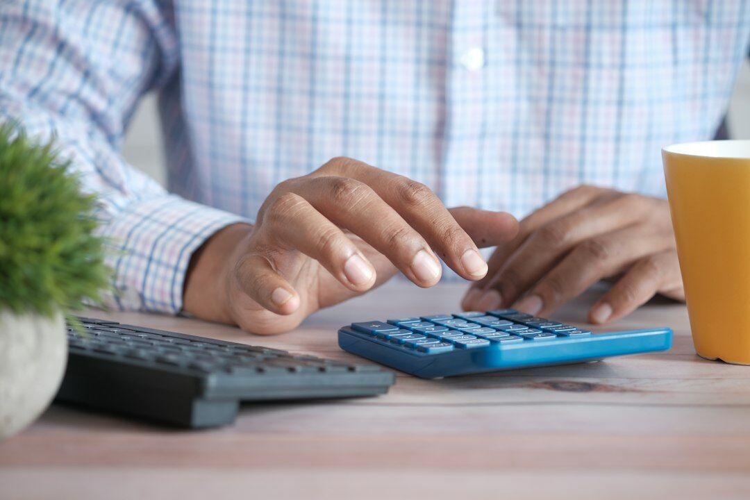 person calculating budget