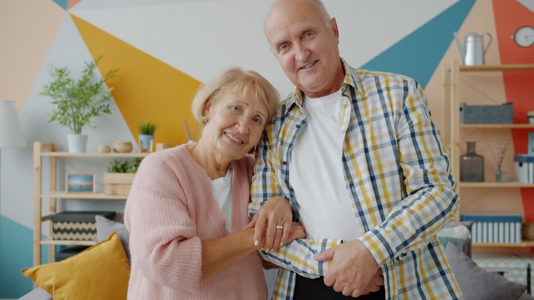 elderly couple smiling