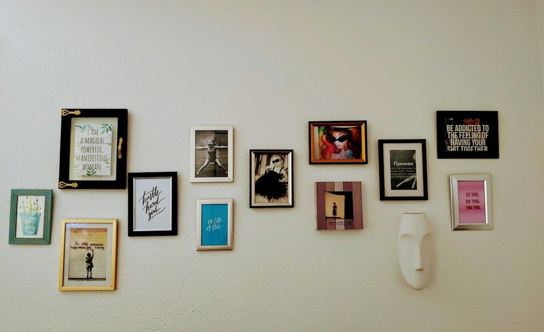Small gallery with framed documentary photographs on the wall