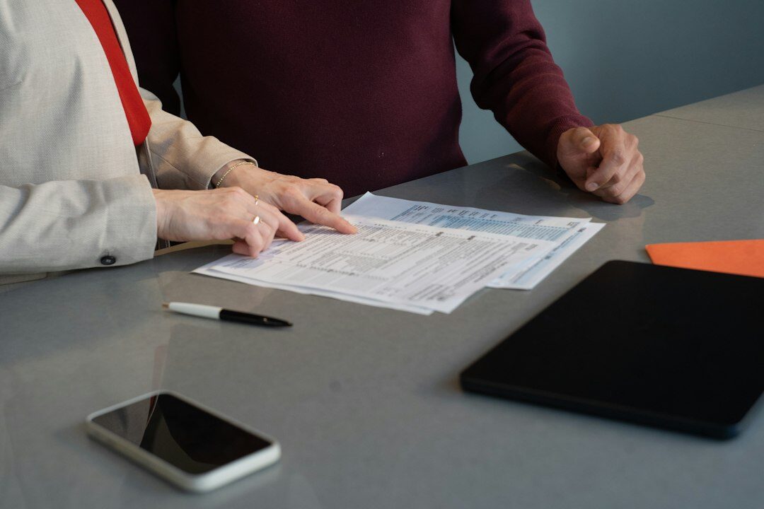 person reviewing insurance policy at desk